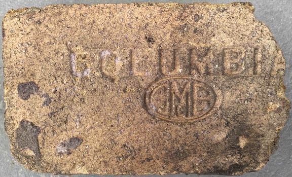 Marked face of the COLUMBIA / GMcB logo brick