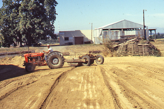 View of the tractor and carryall mining clay at the Hidden brickyard.