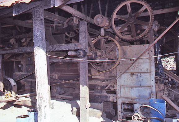 View of the interior of the Hidden brick plant showing the crusher and feeder on 
the left and the Martin brick press on the right.
