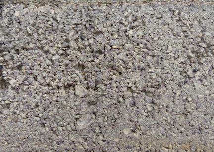 Close up view of the granular surface of the WACo gray pressed brick.