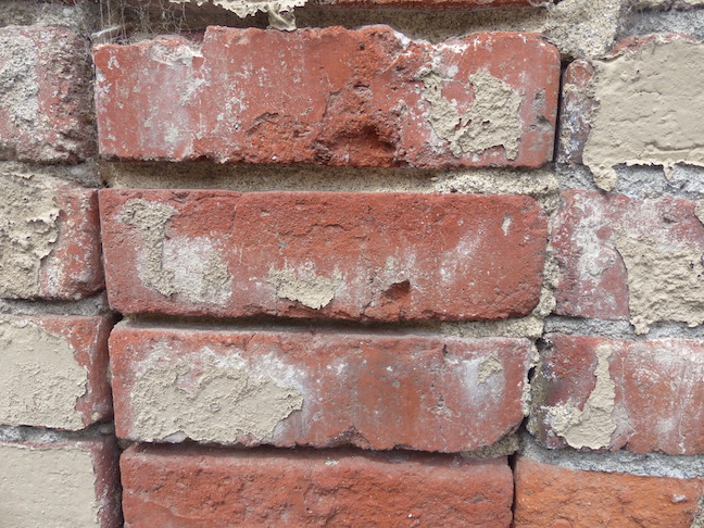 View of the sides of the WACo wire-cut common brick in the wall of the Columbia Building.